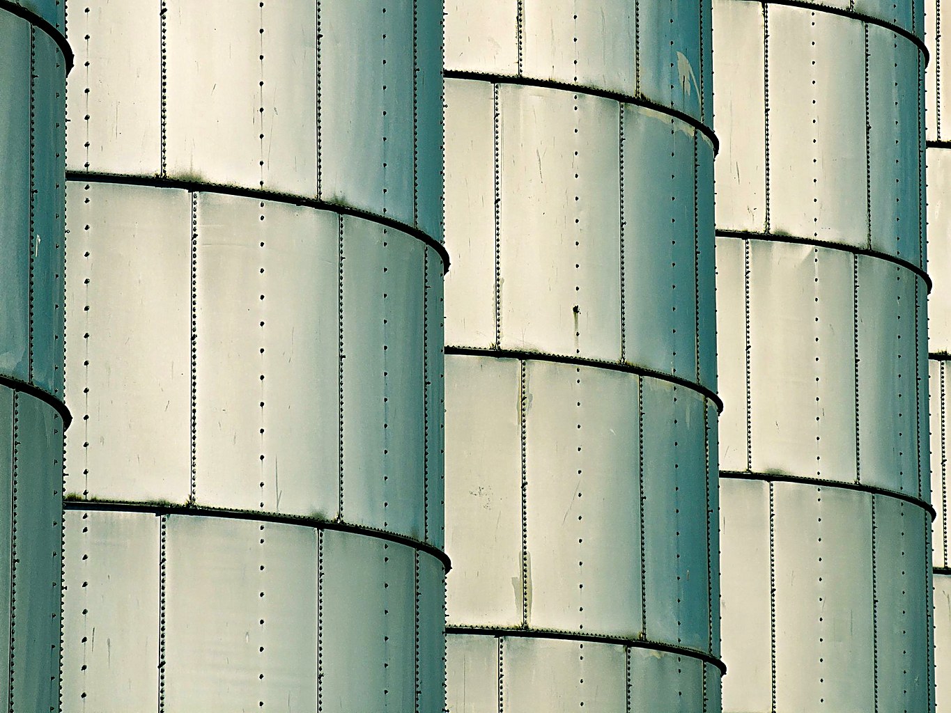Close-up of large steel silo shell walls with ring stiffeners